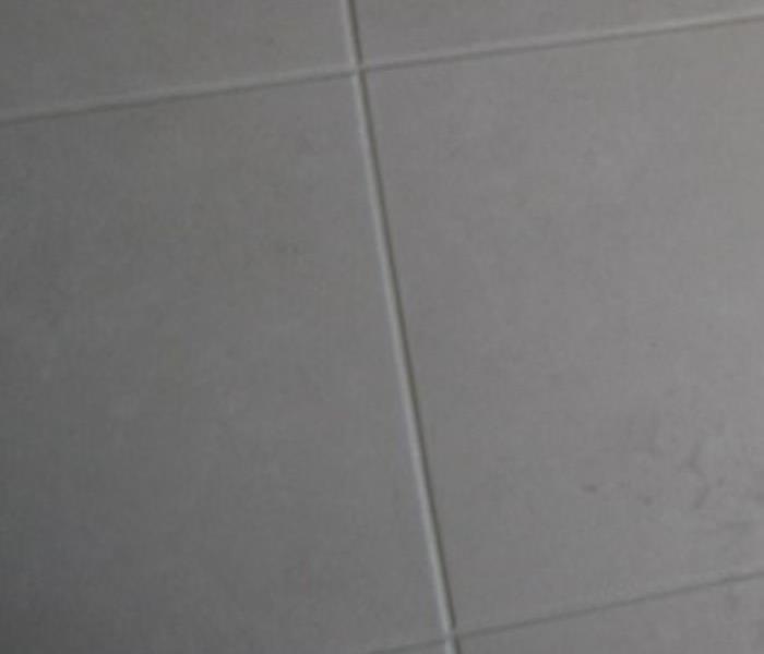 Tile floor before cleaing
